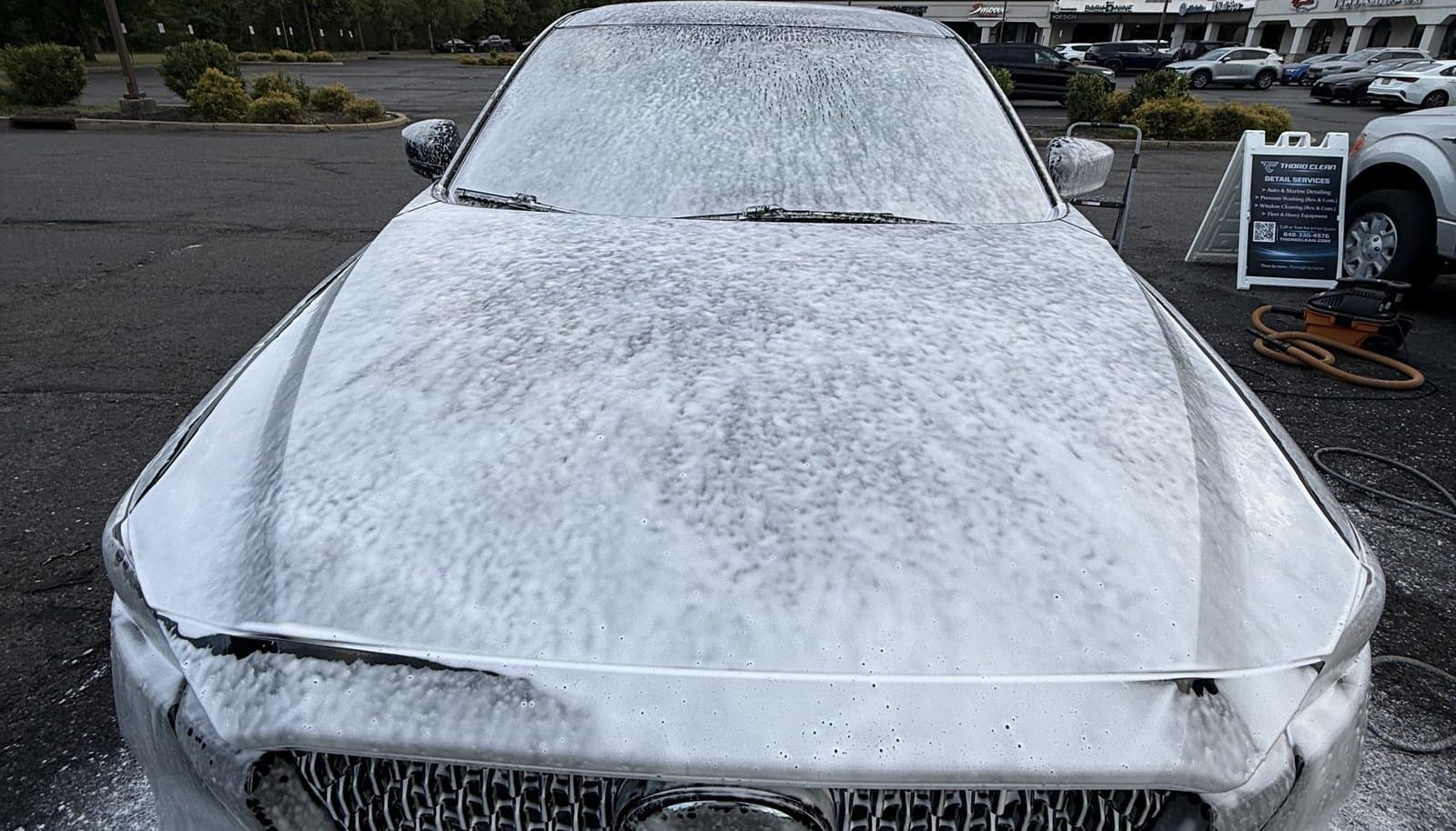 Snow foam pre-wash coating a detailed vehicle