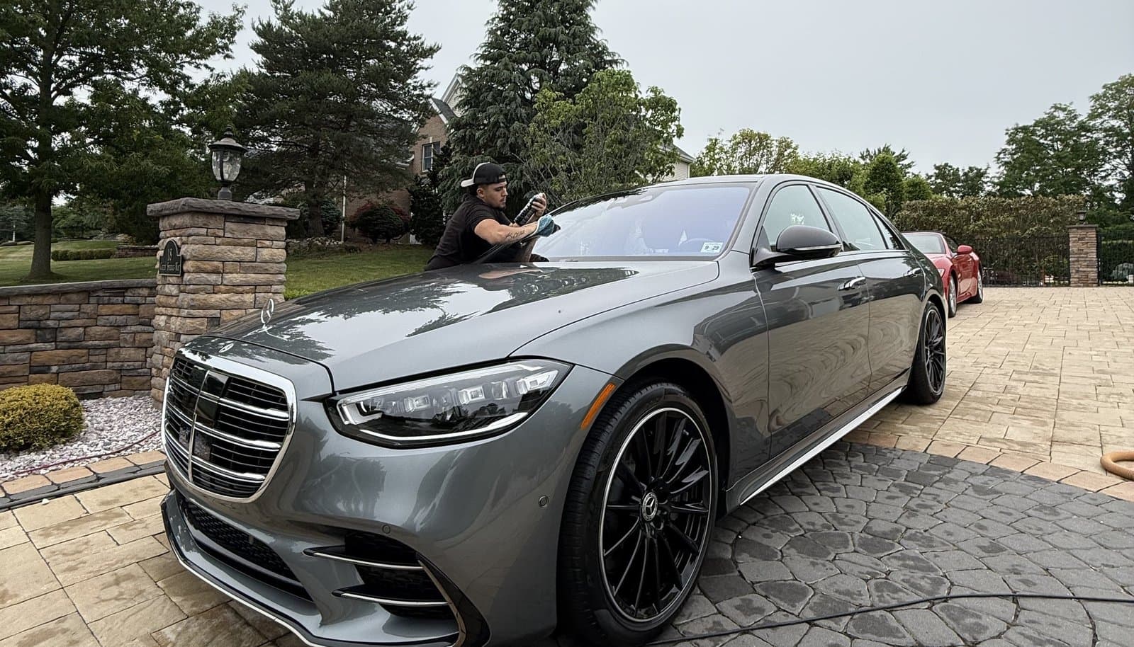 Technician detailing a Mercedes-Benz S-Class